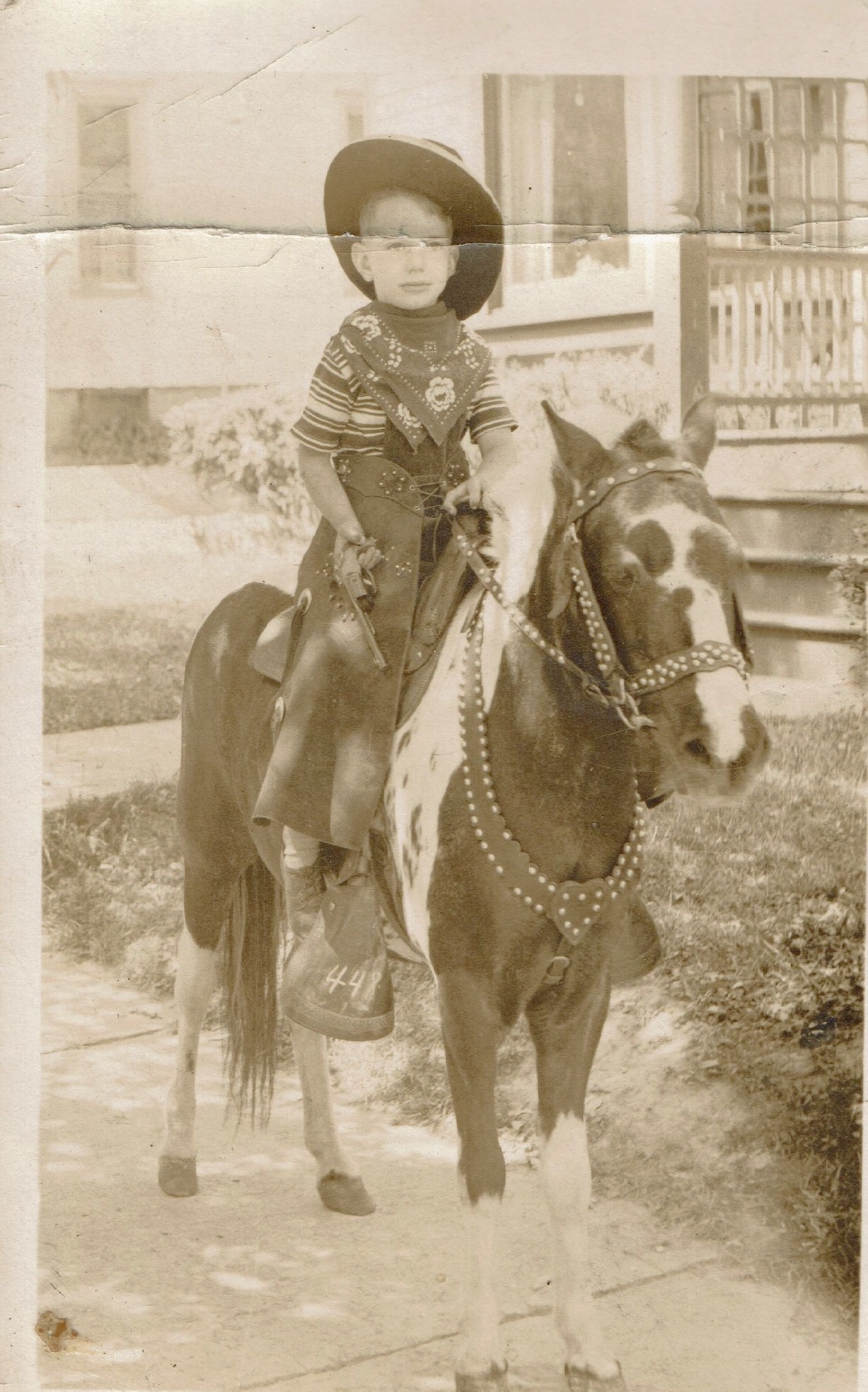 Photo of Bill in cowboy outfit on pony