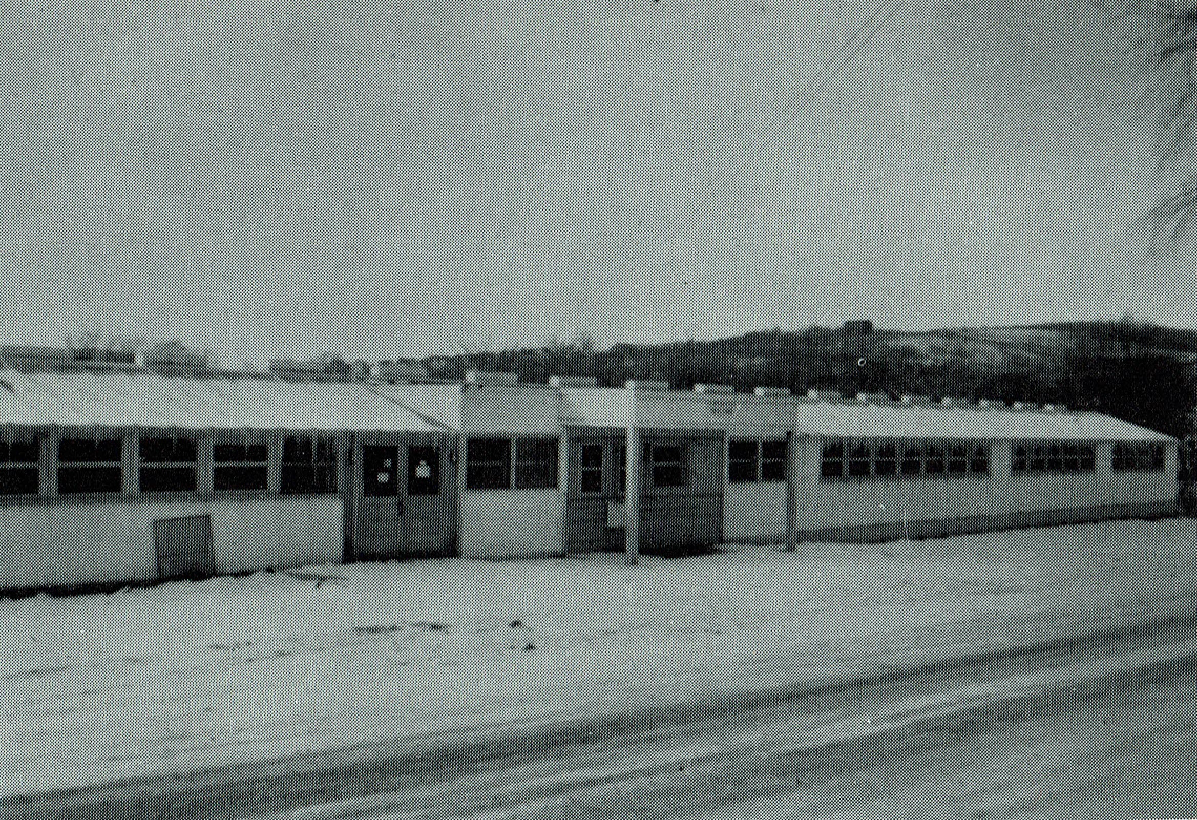 Photo of 'West Hall, one of pre-fab classrom buildings.